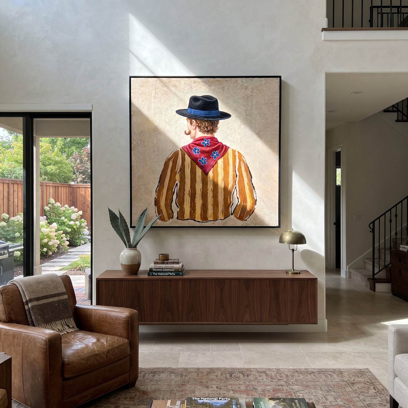 Blue Hat Guards Flowers - back view cowboy painting by Elliot Vale, modern figurative square wall art - styled room scene view 3