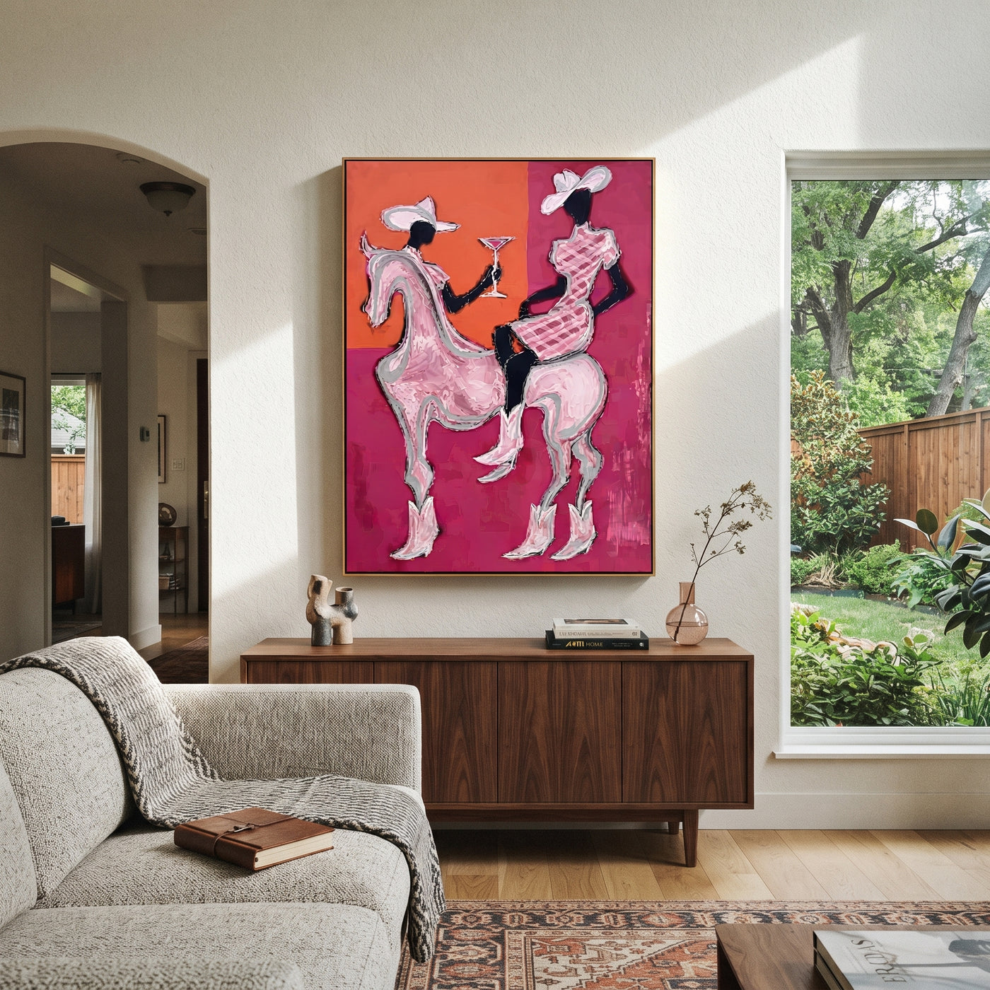 Pink Riders Exchange Toast - pink horse cowgirls painting by Ethan Mercer, contemporary Western vertical wall art – styled room scene view 1
