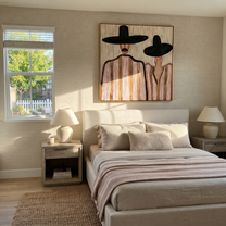 Two Brims Share Quiet – Paired Black Hat Figures painting by Adrian Lee, mid-century modern square wall art – styled room scene view 5