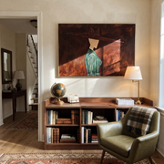 Green Pinstripes Face Shadow – Side Profile Green Figure painting by Adrian Lee, mid-century modern horizontal wall art – styled room scene view 1