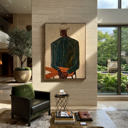 Green Suit Waits Seated – Seated Green Suit Figure painting by Adrian Lee, mid-century modern vertical wall art – styled room scene view 1