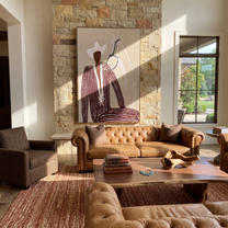 White Rider Shares Sand – White Horse and Figure painting by Adrian Lee, mid-century modern vertical wall art – styled room scene view 2