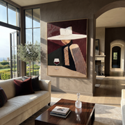 White Brim Keeps the Wine - Wide Hat Wine Figure painting by Adrian Lee, mid-century modern vertical wall art – styled room scene view 1
