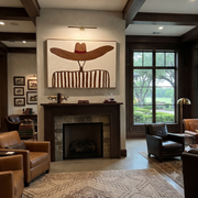 Brown Waves Hide the Face - Undulating Hat Portrait painting by Adrian Lee, mid-century modern horizontal wall art – styled room scene view 1