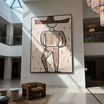 Earth Lines Walk Alone - Geometric Brown Hat Figure painting by Adrian Lee, mid-century modern vertical wall art – styled room scene view 5