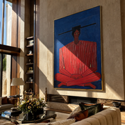Scarlet Stripes Rest on Cobalt - Seated Red Stripe Figure painting by Adrian Lee, mid-century modern vertical wall art – styled room scene view 1