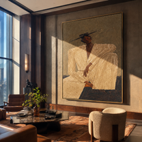 Ivory Angles Rest in Sand - Seated Ivory Suit Figure painting by Adrian Lee, mid-century modern vertical wall art – styled room scene view 4