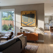 Dark Coats Cross Gold - abstract dark coat pair painting by Adrian Lee, mid-century modern square wall art – styled room scene view 1