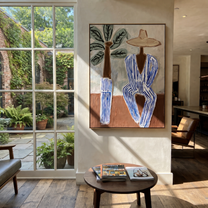 Blue Stripes Wait by Palms - Striped Beach Hat Figure painting by Claire Whitmore, modern coastal vertical wall art – styled room scene view 1