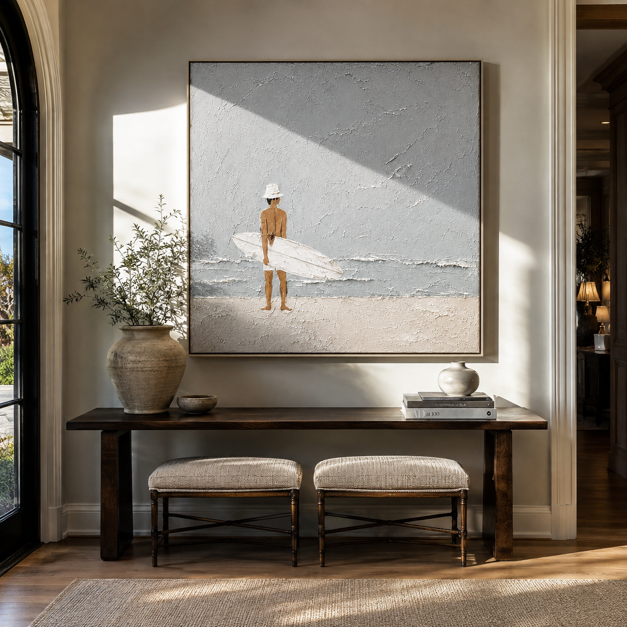 Quiet Surf Finds the Gray Sky - Minimal Surfer on Pale Beach painting by Claire Whitmore, modern coastal square wall art – styled room scene view 5