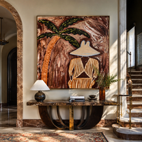Cocoa Palms Shelter Her Stillness - Striped Woman under Palm painting by Claire Whitmore, modern coastal square wall art – styled room scene view 1