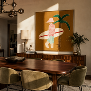 Red Stripes Pause beneath the Palm - Golden Beach Surfer painting by Claire Whitmore, modern coastal square wall art – styled room scene view 1