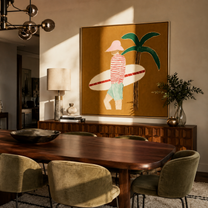 Red Stripes Pause beneath the Palm - Golden Beach Surfer painting by Claire Whitmore, modern coastal square wall art – styled room scene view 1