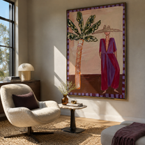 Violet Dress Waits beneath Leaves - Resort Woman and Sculptural Palm painting by Claire Whitmore, modern coastal vertical wall art – styled room scene view 1