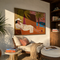 White Linen Reclines by the Bay - Coastal Lounge Woman at Sunset painting by Claire Whitmore, modern coastal horizontal wall art – styled room scene view 5