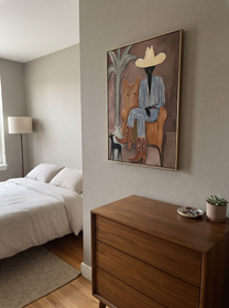 Striped Cowboy Keeps Watch - striped cowboy with dog painting by Claire Whitmore, modern coastal vertical wall art – styled room scene view 10