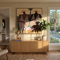 Pink Suits Face Palms - pink resort figure pair painting by Claire Whitmore, modern coastal square wall art – styled room scene view 1