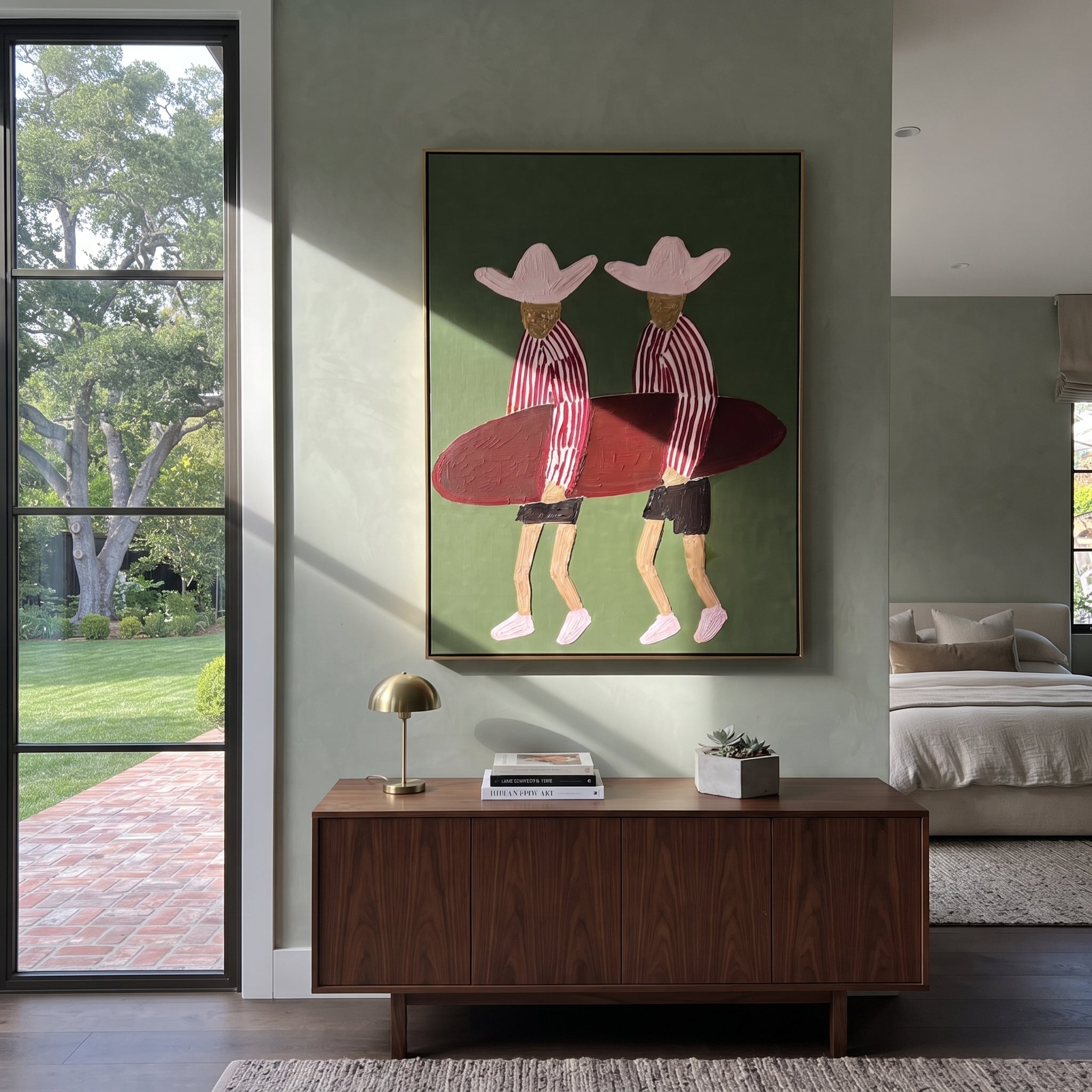 Twin Hats Carry Burgundy - surfboard figure pair painting by Claire Whitmore, modern coastal vertical wall art – styled room scene view 3