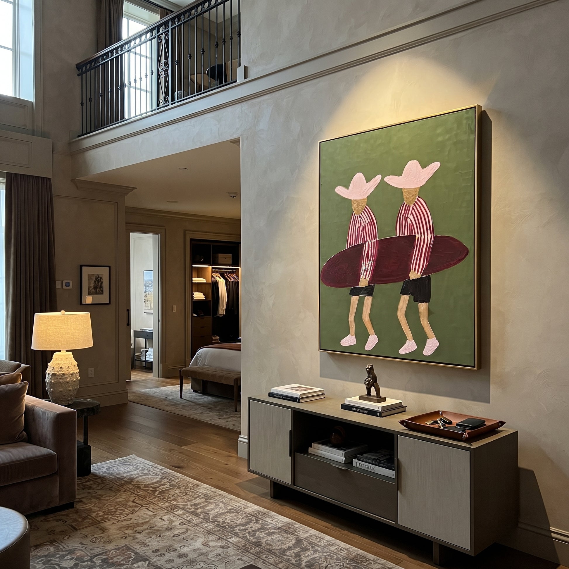 Twin Hats Carry Burgundy - surfboard figure pair painting by Claire Whitmore, modern coastal vertical wall art – styled room scene view 5