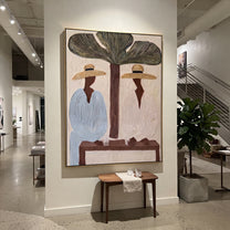 Tree Shade Divides Linen - tropical tree figure pair painting by Claire Whitmore, modern coastal vertical wall art – styled room scene view 4
