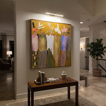 Feathered Hats Form a Chorus - colorful western figures painting by Savannah Reed, modern folk art square wall art – styled room scene view 5