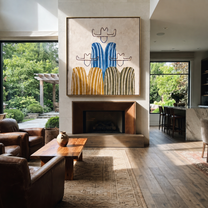 Blue Stripes Hold the Center - five minimalist cowboy figures painting by Savannah Reed, modern folk art square wall art – styled room scene view 3