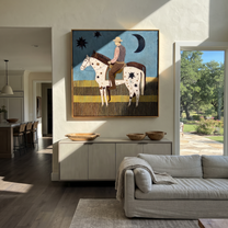 Stars Cross Midnight - star-spotted horse and rider painting by Savannah Reed, modern folk art square wall art – styled room scene view 5