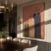 Three Hats Lean Close - three striped cowboy figures painting by Savannah Reed, modern folk art vertical wall art – styled room scene view 1