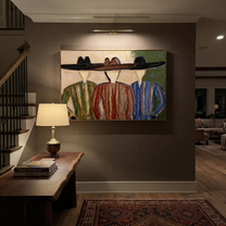 Wide Hats Share Shade - three cowboy portrait painting by Savannah Reed, modern folk art horizontal wall art – styled room scene view 5