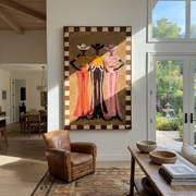 Three Hats Hold Ground - three cowgirls full-length painting by Savannah Reed, modern folk art vertical wall art – styled room scene view 1