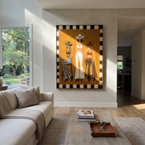 Mustard Room Holds Three - three cowgirls lounge painting by Savannah Reed, modern folk art vertical wall art – styled room scene view 3