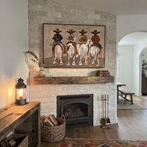 Four Riders Head Home - four horse riders painting by Savannah Reed, modern folk art horizontal wall art – styled room scene view 5