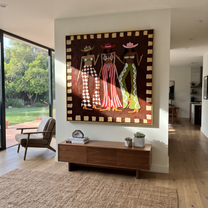 Three Patterns Hold Court - patterned cowgirls portrait painting by Savannah Reed, modern folk art square wall art – styled room scene view 1