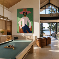 Rose Brim Holds the Green Room - seated pink cowboy painting by Savannah Reed, modern folk art vertical wall art – styled room scene view 3