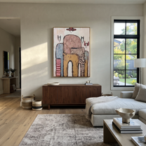 Hats Drift Through Stone - abstract cowboy figures painting by Savannah Reed, modern folk art vertical wall art – styled room scene view 5