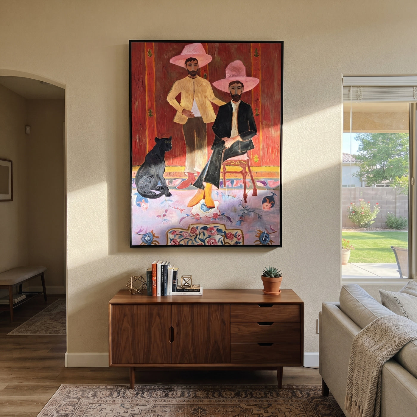 Pink Hats Keep Company - cowboy dog interior painting by Savannah Reed, modern folk art vertical wall art – styled room scene view 1