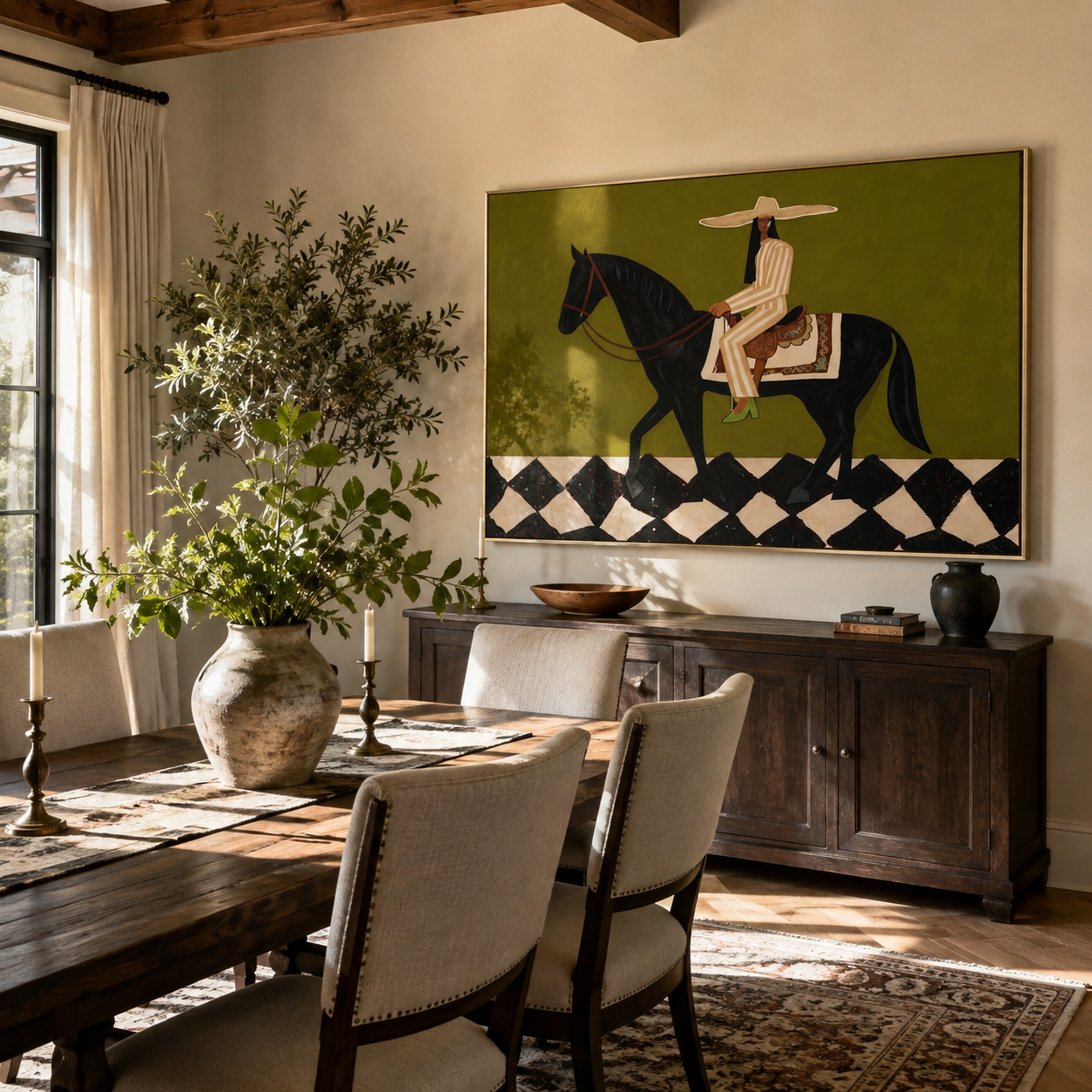 Harlequin Road Carries Her – Olive Cowgirl on Black Horse painting by Isabelle Laurent, modern Western horizontal wall art – styled room scene view 2