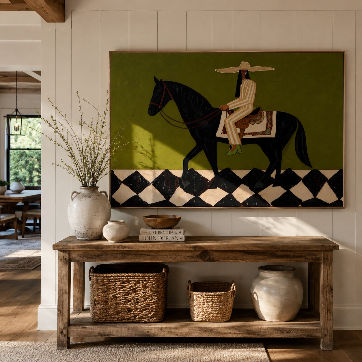 Harlequin Road Carries Her – Olive Cowgirl on Black Horse painting by Isabelle Laurent, modern Western horizontal wall art – styled room scene view 3
