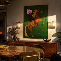 Pink Brim Raises Thunder – Pink Hat Rider and Rearing Horse painting by Isabelle Laurent, modern Western vertical wall art – styled room scene view 1