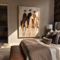 Three Hats Ride Pale – Three Riders on Pale Horses painting by Isabelle Laurent, modern Western vertical wall art – styled room scene view 3