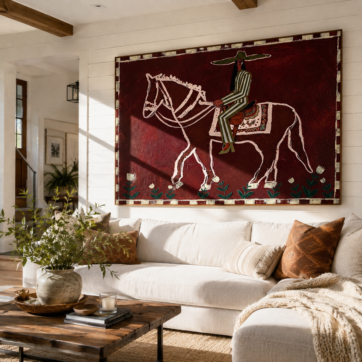 Burgundy Bones Keep Time – Striped Rider on Skeleton Horse painting by Isabelle Laurent, modern Western horizontal wall art – styled room scene view 3