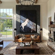 Quiet Reins Hold the Horizon - figure and horse painting by Isabelle Laurent, modern Western vertical wall art – styled room scene view 1