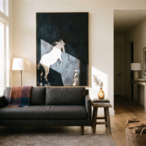 Quiet Reins Hold the Horizon - figure and horse painting by Isabelle Laurent, modern Western vertical wall art – styled room scene view 3