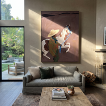 Quiet Reins Cross the Quiet Field - figure and horse painting by Isabelle Laurent, modern Western vertical wall art – styled room scene view 1