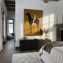 Painted Saddle Cross the Quiet Field - horse and rider painting by Isabelle Laurent, modern Western vertical wall art – styled room scene view 2