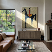 Western Stars Cross the Quiet Field - horse and rider painting by Isabelle Laurent, modern Western vertical wall art – styled room scene view 1