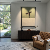 Amber Trail Cross the Quiet Field - horse and rider painting by Isabelle Laurent, modern Western vertical wall art – styled room scene view 3