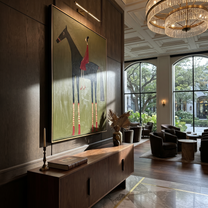 Wild Grace Carry the Morning - horse and rider painting by Isabelle Laurent, modern Western vertical wall art – styled room scene view 5