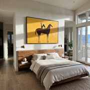Still Hooves Meet the Open Sky - horse and rider painting by Isabelle Laurent, modern Western horizontal wall art – styled room scene view 1