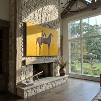 Still Hooves Meet the Open Sky - horse and rider painting by Isabelle Laurent, modern Western horizontal wall art – styled room scene view 3